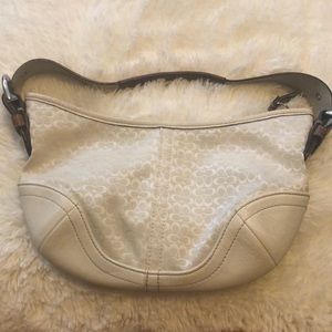 White and tan signature Coach purse